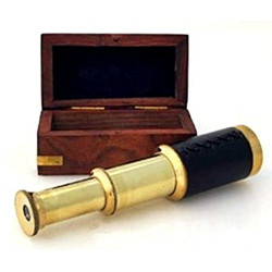 A small telescope by its wooden box.