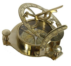 Picture of a brass sundial with a compass in the center.